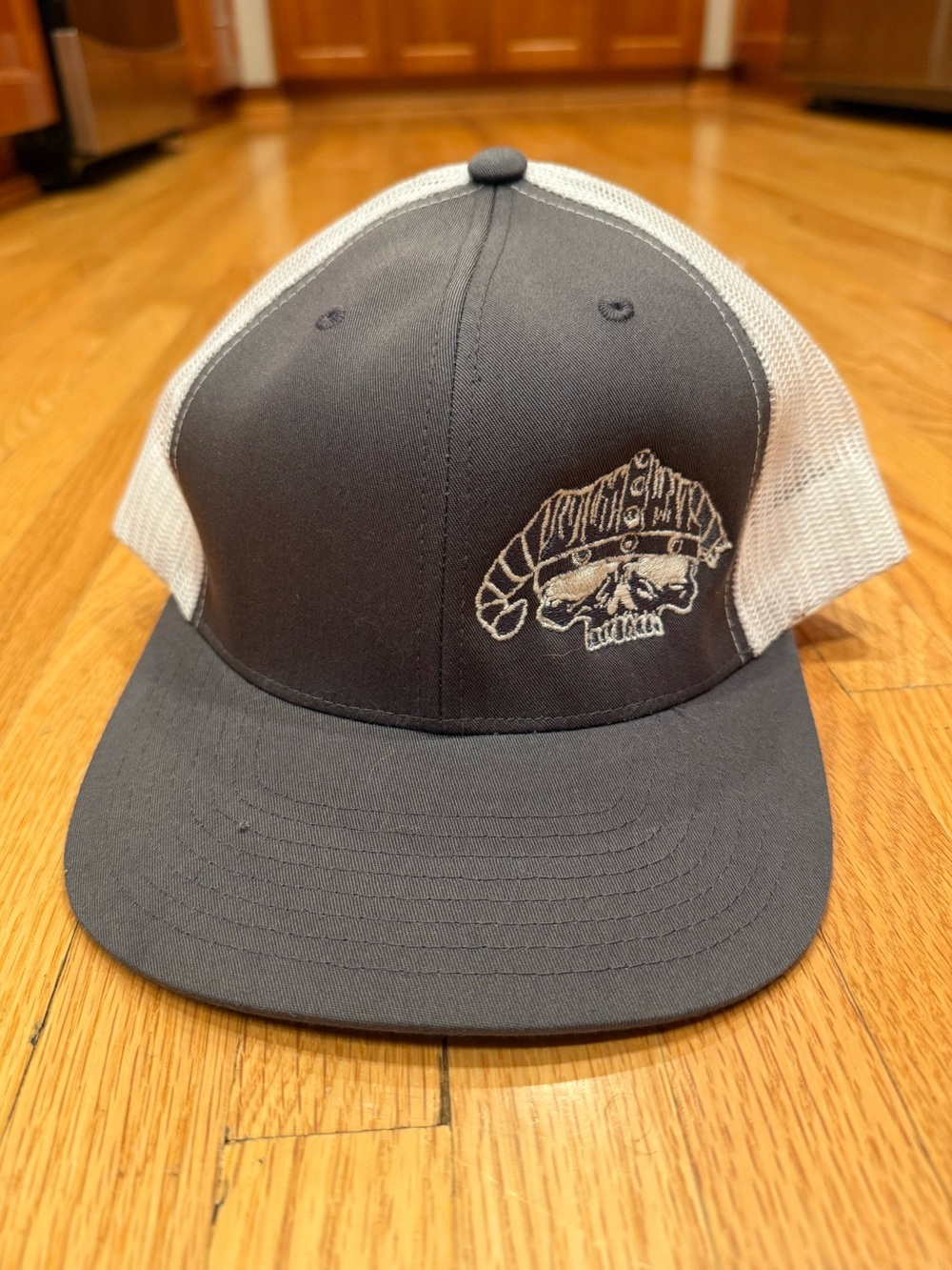 Charcoal and White Mesh Trucker Hat with Embroidered Skull Patch